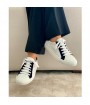 woman navy and white leather sneakers