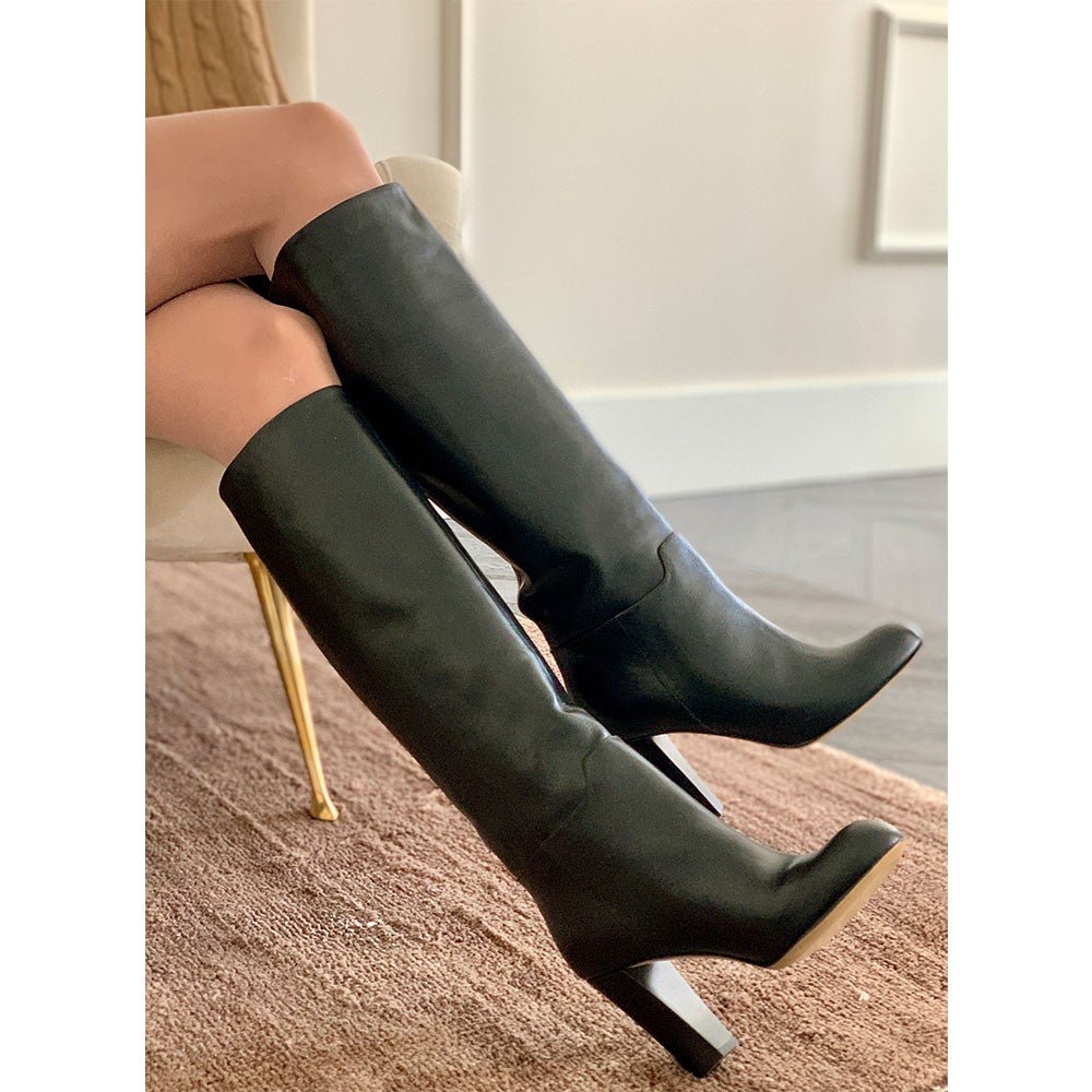 Bottes cuir noir fabrication italie jambes croisées