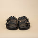 PAROS Flat black leather and rhinestone sandals