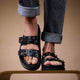 PAROS Flat black leather and rhinestone sandals